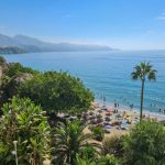 A beach with lush trees just behind on the Costa Del Sol